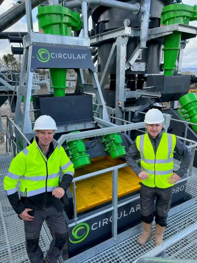 Circular Group founders with a wet processing machine.