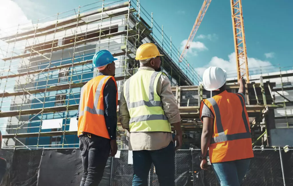 A group of builders assessing progress at a construction site